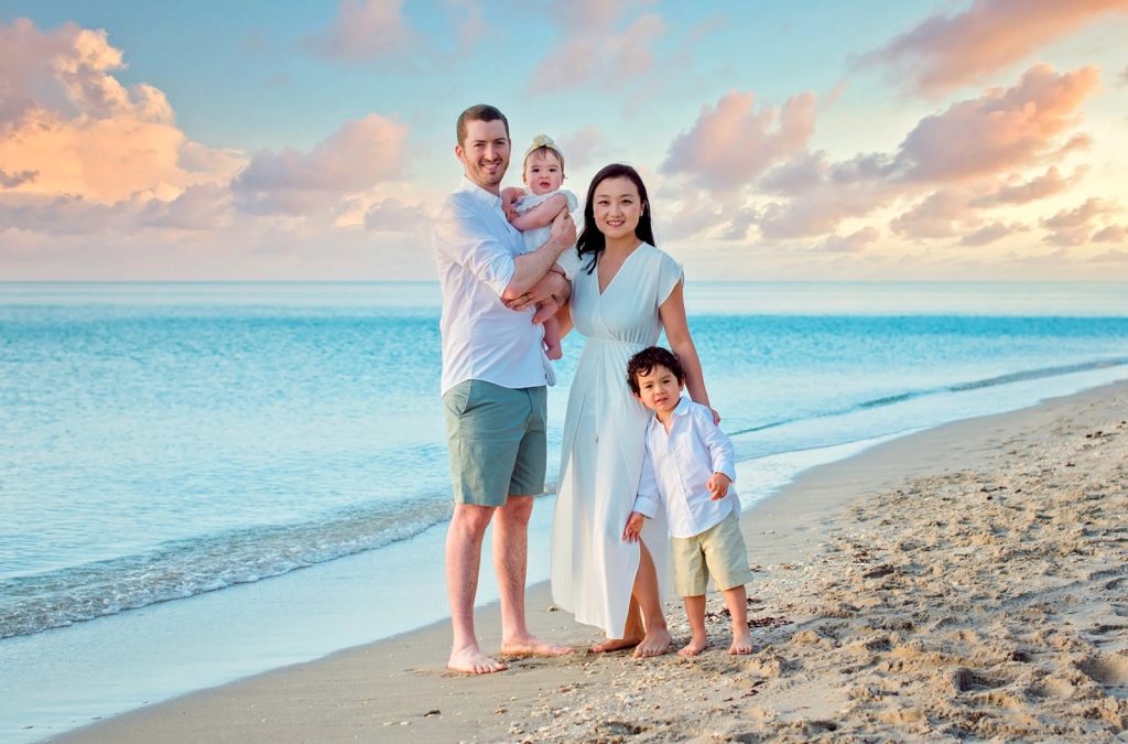 Family walking casually on Sombero Beach in Marathon Florida. FloridaKeysVillas.com