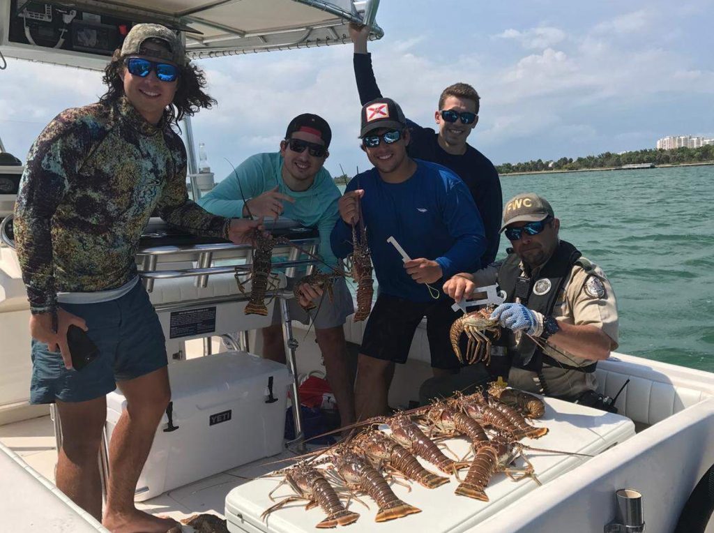 Florida Fish and Wildlife Conservation Commission (FWC) Checking Lobster Sizes. FloridaKeysVillas.com