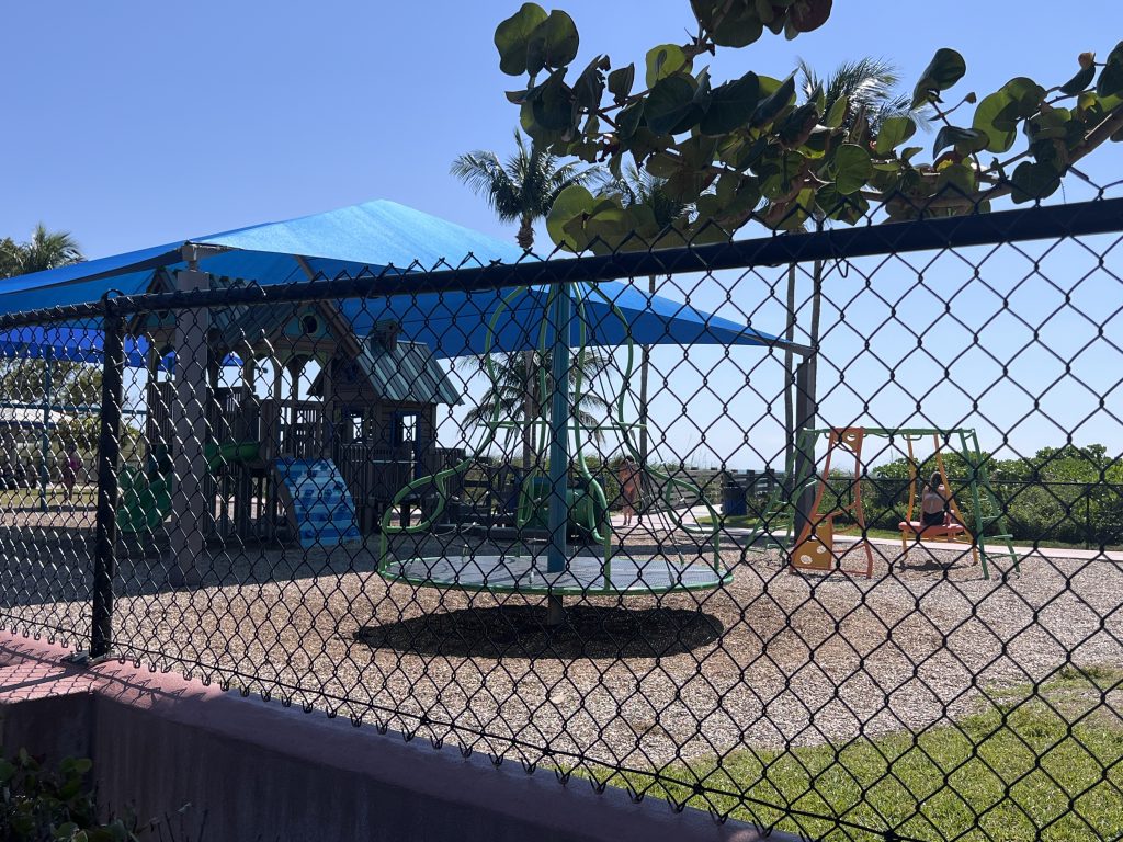 Children's Playground with shade and swings and fun house to climb at Sombrero Beach. FloridaKeysVillas.com