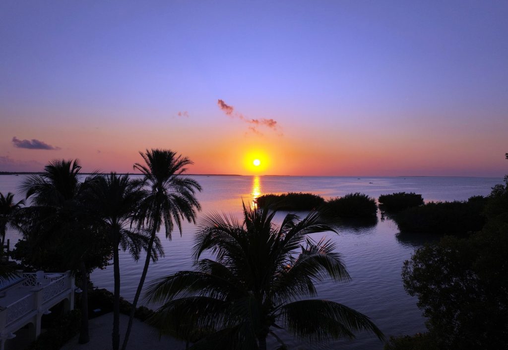 Florida Keys sunset over water. Fall sunset over the Florida Keys near Marathon Florida vacation homes and waterfront villas. FloridaKeysVillas.com