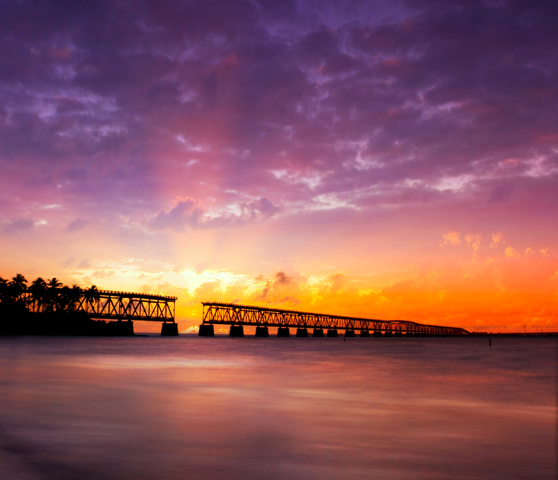 Beautiful Purple, Orange and Yellow Sunset in Bahia Honda State Park at the Old Railroad Bridge. FloridaKeysVillas.com