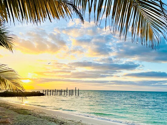 Sunrise over Key Colony Beach canal homes. Booking Direct and Save with FloridaKeysVillas.com