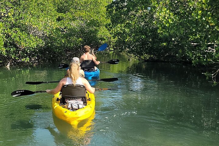 Paddleboarding in calm Florida Keys water. Booking Direct and Save with FloridaKeysVillas.com